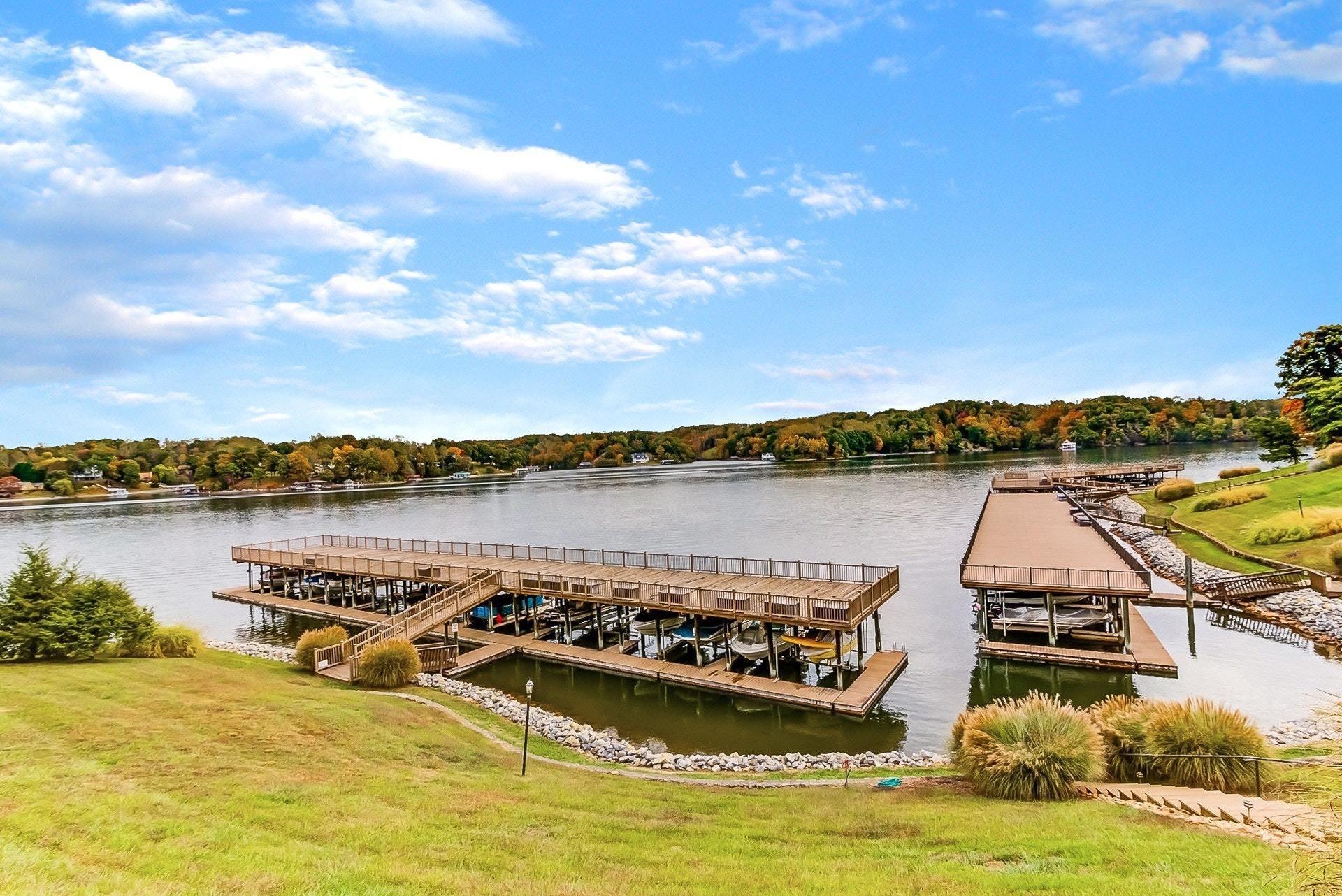 a view of a lake with houses in the back