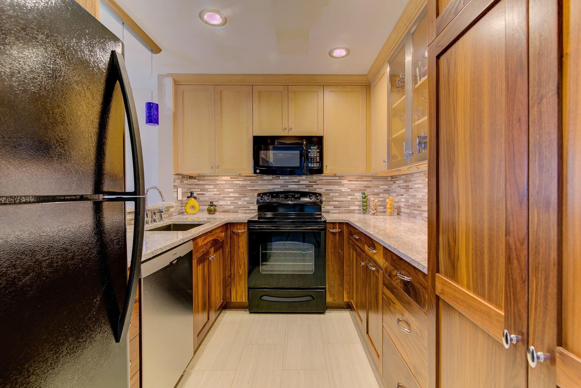 835 Gangplank Road, Unit 103 Moneta, VA 24121 - Photo 13 of 34 a kitchen with stainless steel appliances granite countertop a stove a sink and a refrigerator
