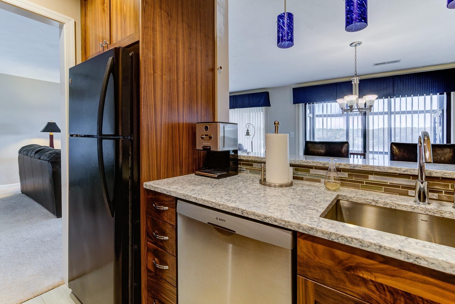 835 Gangplank Road, Unit 103 Moneta, VA 24121 - Photo 15 of 34 a kitchen with stainless steel appliances granite countertop a refrigerator and a sink