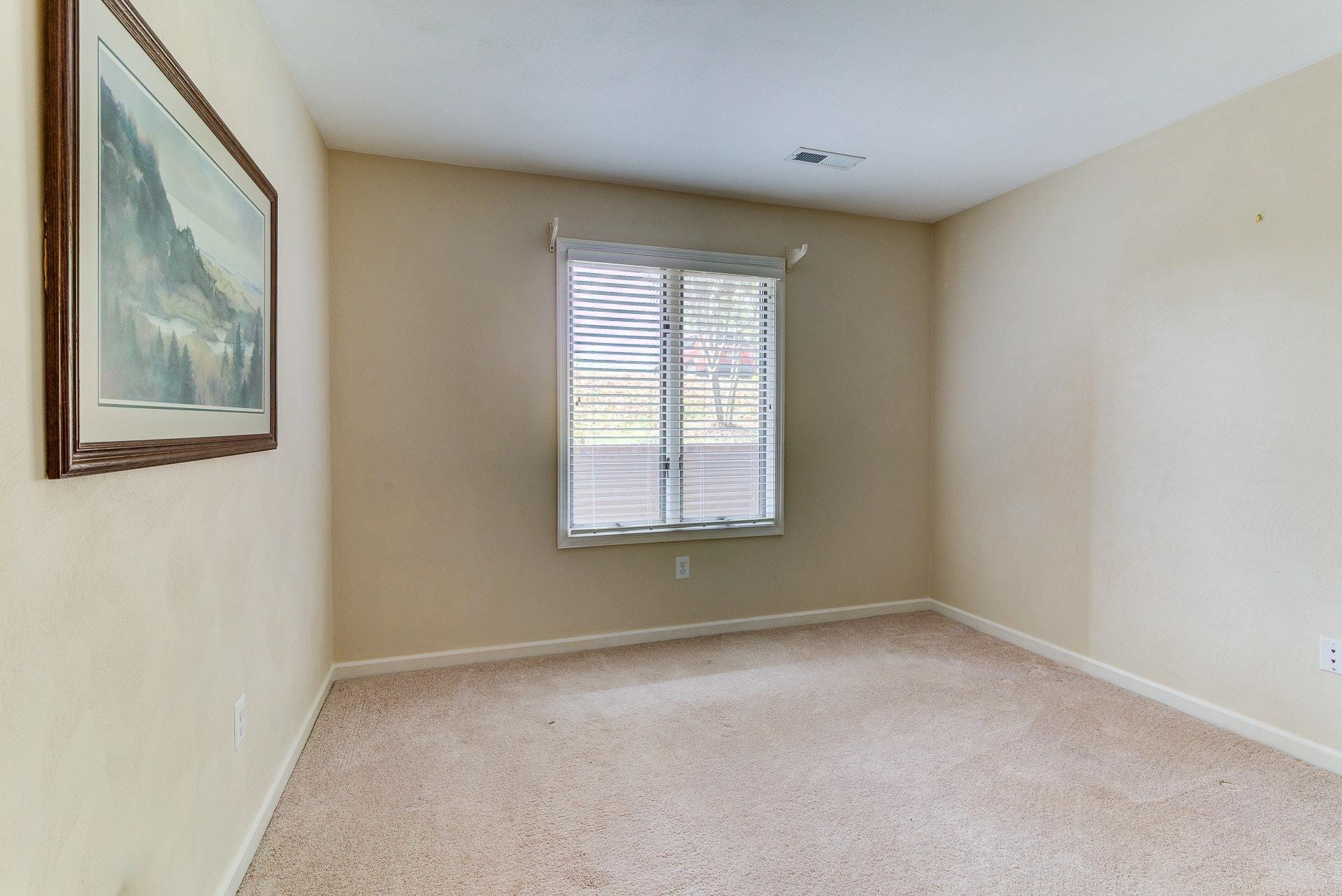 835 Gangplank Road, Unit 103 Moneta, VA 24121 - Photo 20 of 34 a view of an empty room with a window