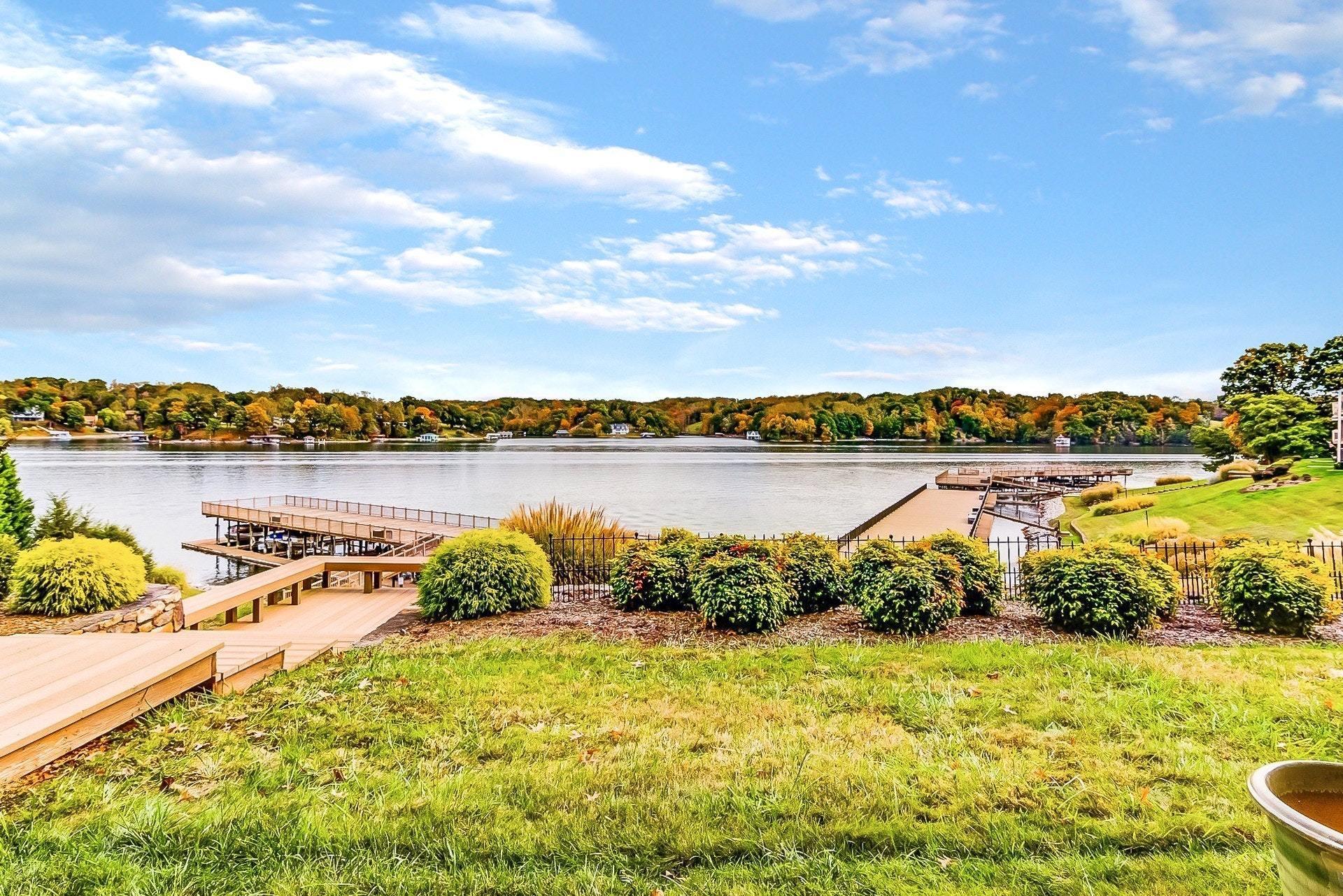 835 Gangplank Road, Unit 103 Moneta, VA 24121 - Photo 26 of 34 a view of a lake with houses in the back