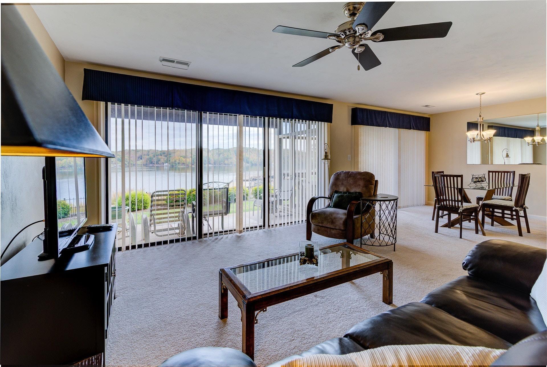 835 Gangplank Road, Unit 103 Moneta, VA 24121 - Photo 7 of 34 a living room with furniture and a flat screen tv