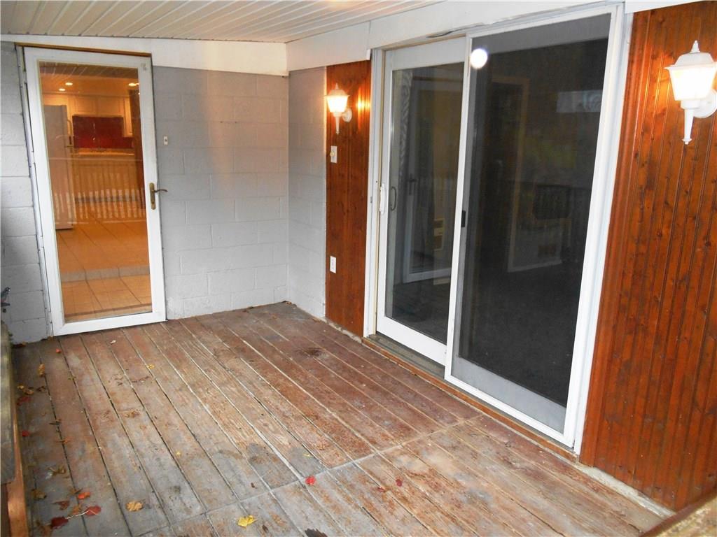 5990 Library Road Bethel Park, PA 15102 - Photo 2 of 24 The lower level covered porch leads to the kitchen and the living room.