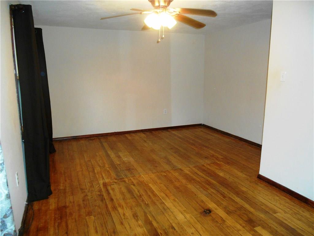 5990 Library Road Bethel Park, PA 15102 - Photo 15 of 24 The master bedroom with hard wood floors and a ceiling fan.