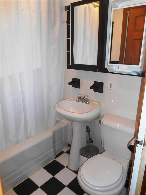 5990 Library Road Bethel Park, PA 15102 - Photo 18 of 24 Retro, black and white bath room with full tub/shower combo!