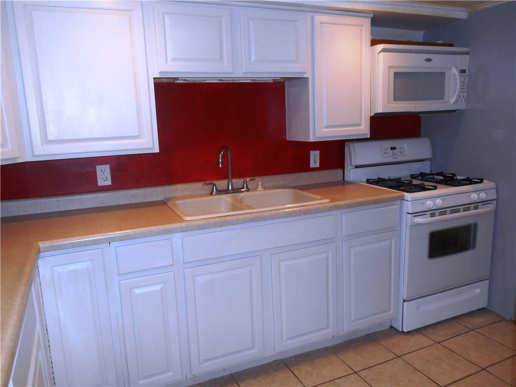 5990 Library Road Bethel Park, PA 15102 - Photo 7 of 24 Add some decorative knobs to "jazz" up this white washed cabinets.