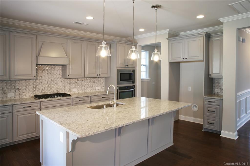 140 Helton Lane, Unit 36 Fort Mill, SC 29708 - Photo 2 of 21 a kitchen with a center island appliances and cabinets