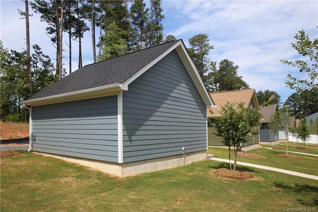 140 Helton Lane, Unit 36 Fort Mill, SC 29708 - Photo 11 of 21 a backyard of a house with plants and tree