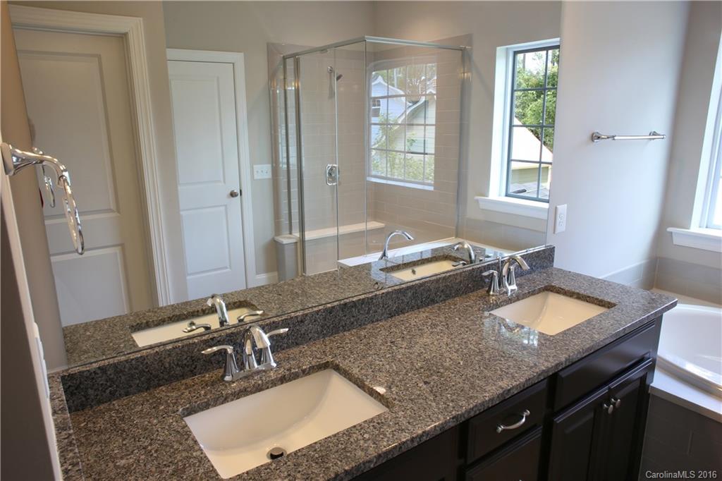140 Helton Lane, Unit 36 Fort Mill, SC 29708 - Photo 15 of 21 a bathroom with a granite countertop sink and a mirror