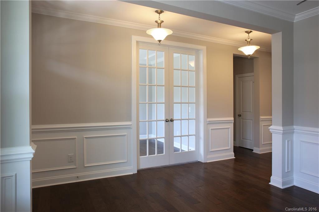 140 Helton Lane, Unit 36 Fort Mill, SC 29708 - Photo 9 of 21 a view of an empty room with wooden floor and a window