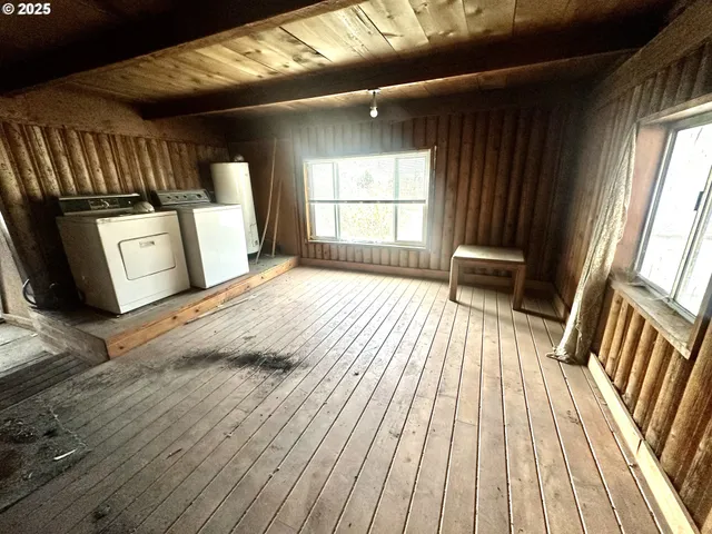a view of wooden floor in a hall with wooden floor