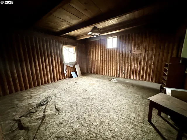 a view of a livingroom with furniture and white walls