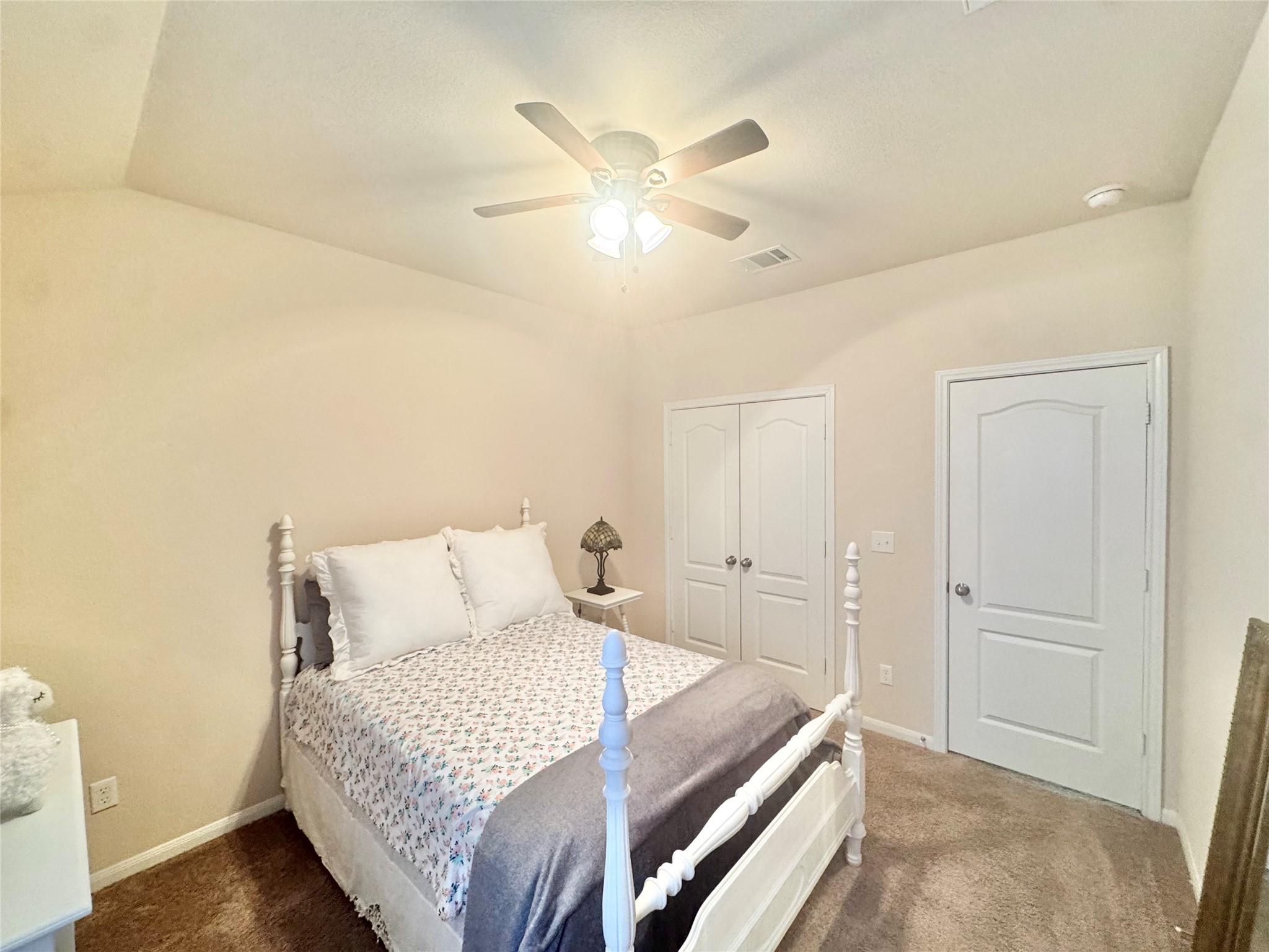 413 Gettysburg Loop Elgin, TX 78621 - Photo 21 of 32 Bedroom featuring a closet, a ceiling fan, and dark colored carpet