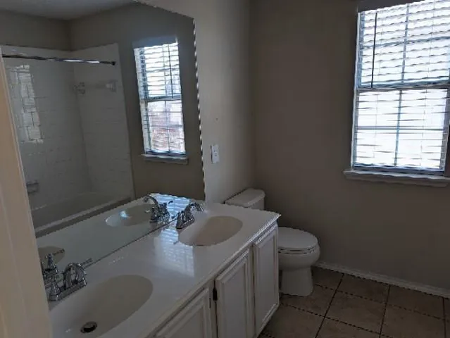 a bathroom with a sink toilet and tub