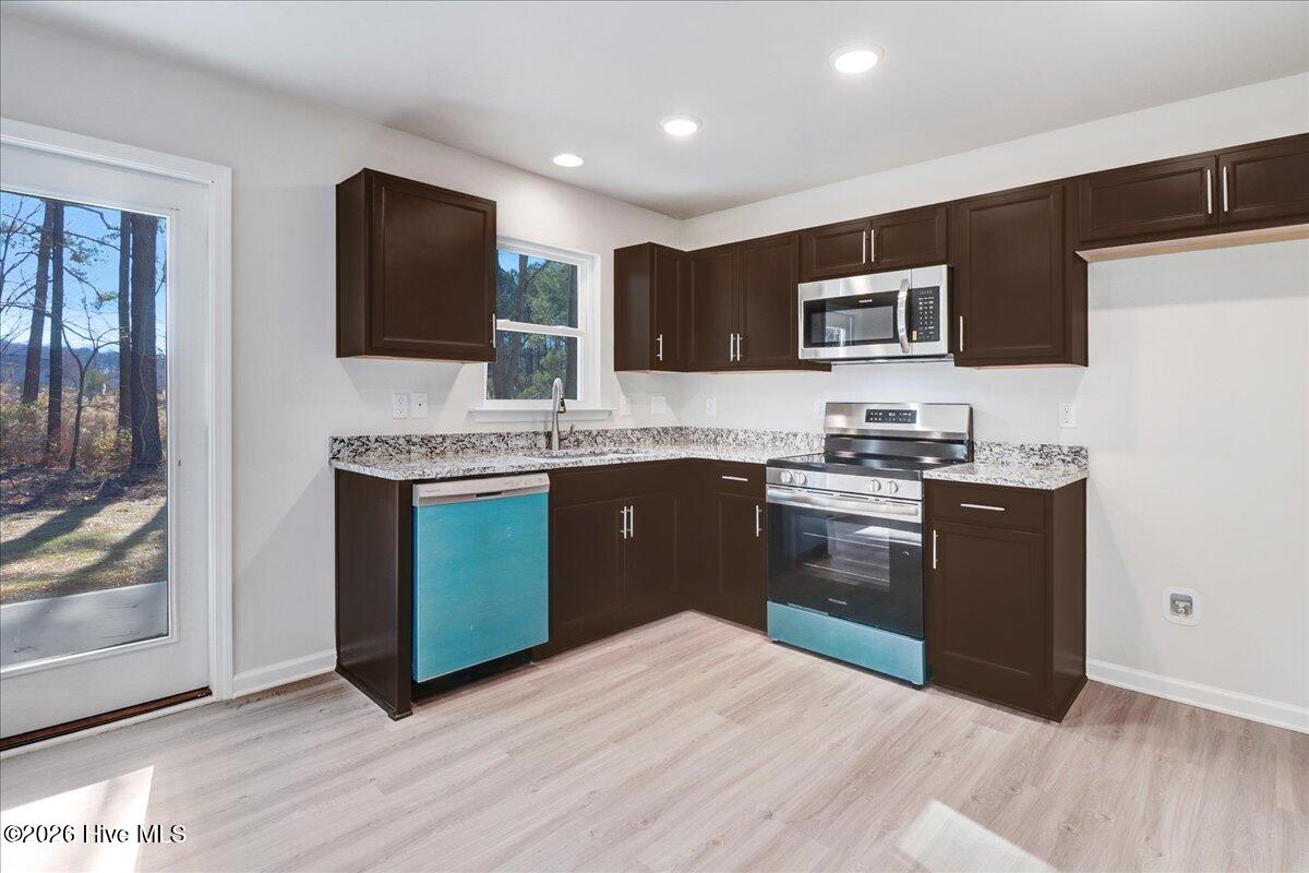 11379 Red Bud Road Castalia, NC 27816 - Photo 6 of 29 Stainless Steel appliances - the blue is the protective film