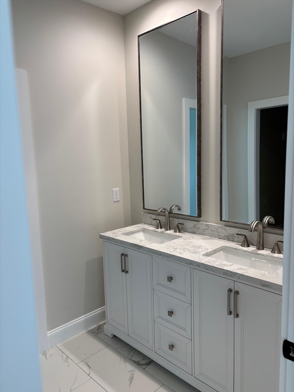 190 Whitins Road Sutton, MA 01590 - Photo 14 of 15 a bathroom with a granite countertop sink and a mirror
