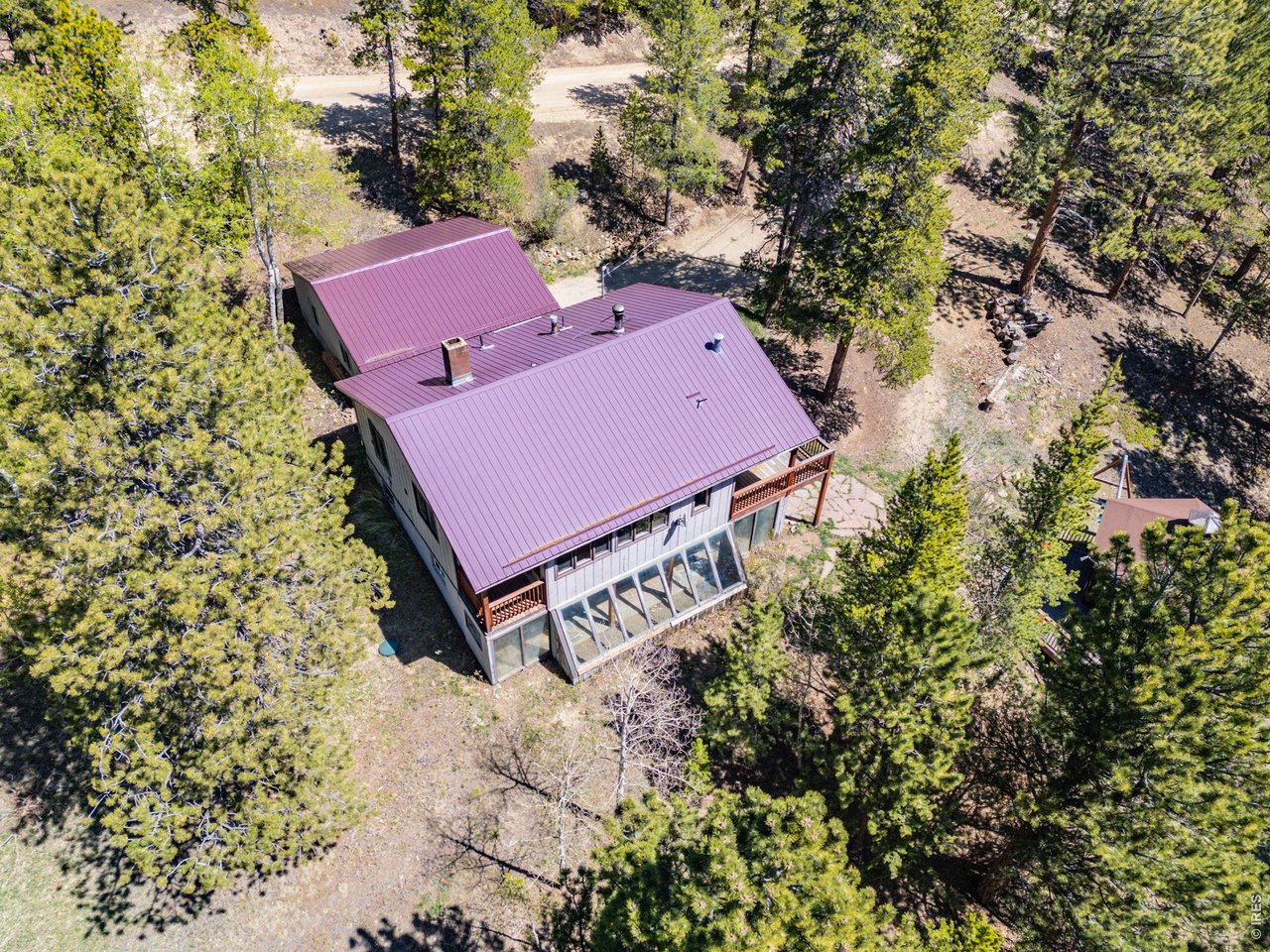 414 Upper Travis Gulch Road Black Hawk, CO 80422 - Photo 6 of 50 an aerial view of a house with a yard