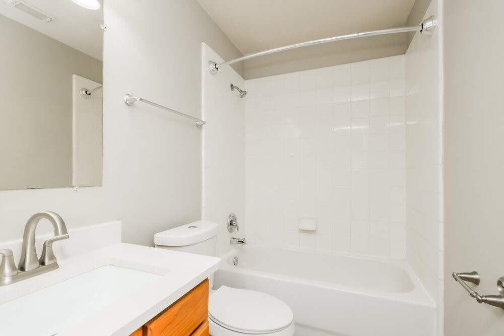 11747 Elizabeth Court Pinehurst, TX 77362 - Photo 15 of 16 a bathroom with a sink toilet and shower