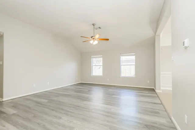 a view of a kitchen with refrigerator and cabinet