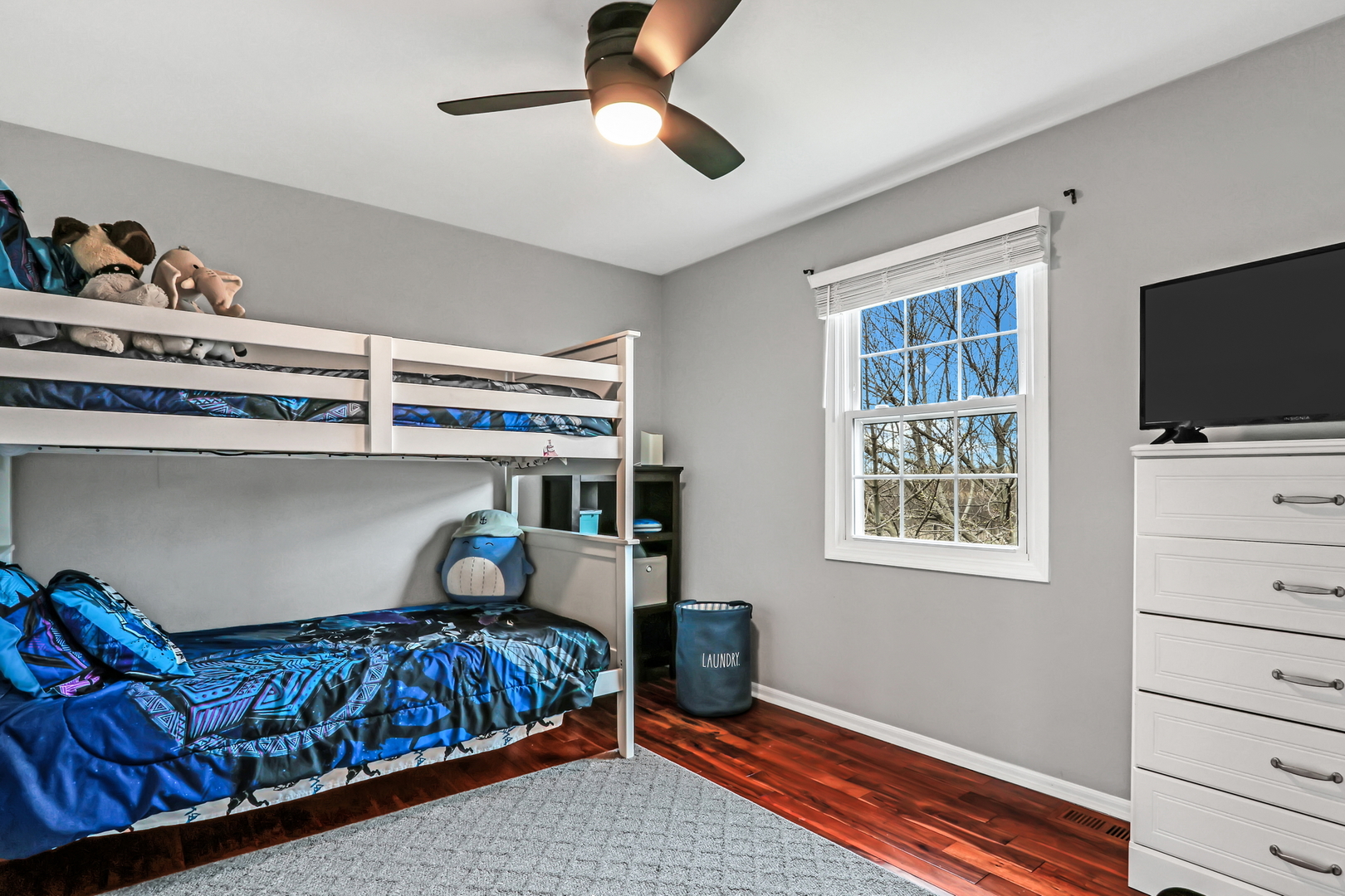 4049 Ridge Road Zion, IL 60099 - Photo 18 of 28 a bedroom with a bed and wooden floor