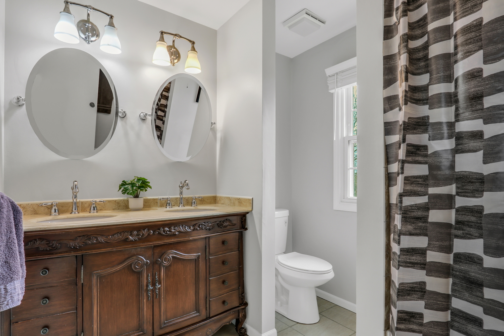 4049 Ridge Road Zion, IL 60099 - Photo 22 of 28 a bathroom with a granite countertop toilet sink and mirror