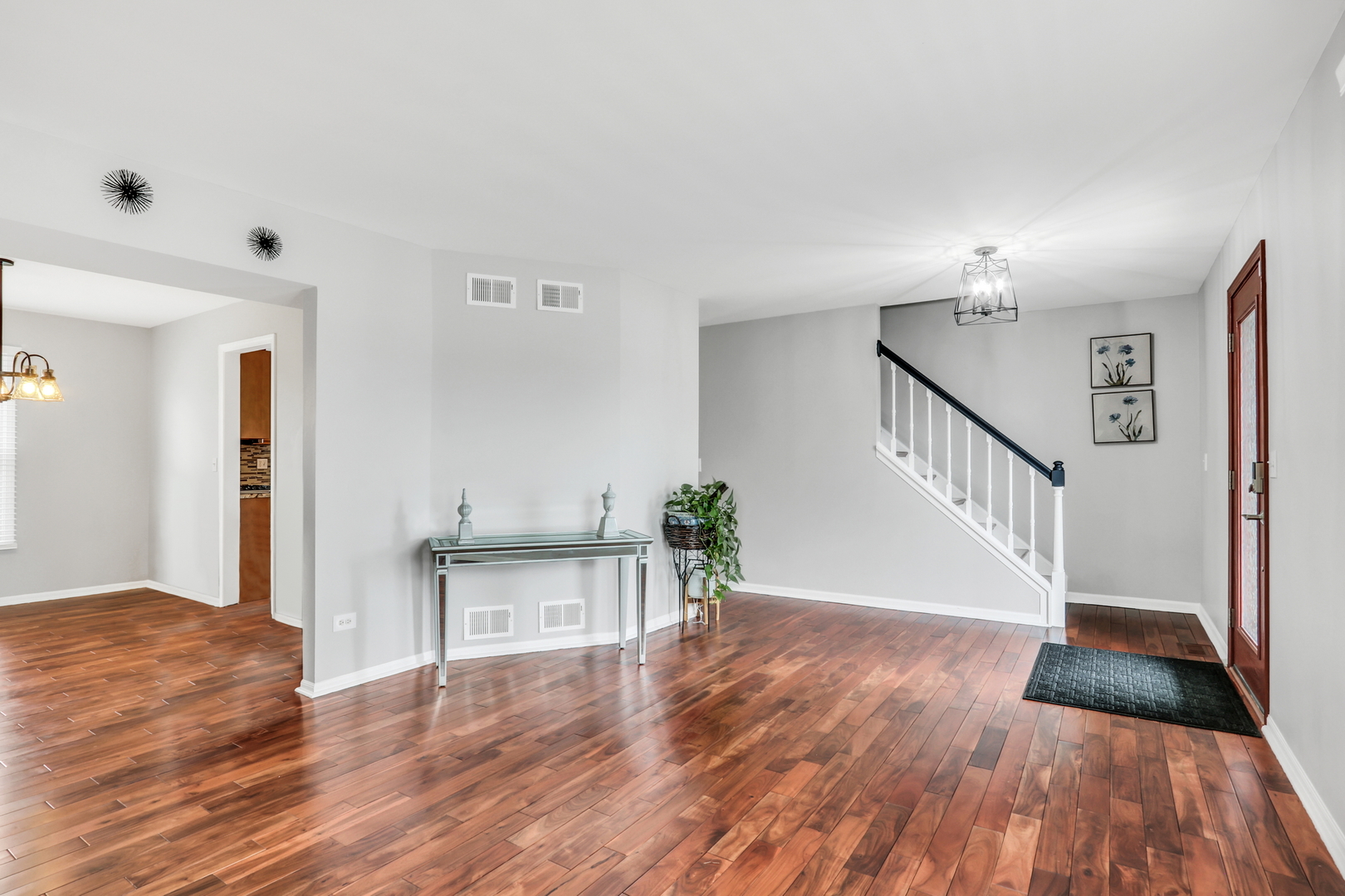 4049 Ridge Road Zion, IL 60099 - Photo 3 of 28 a view of a hallway view with wooden floor and staircase