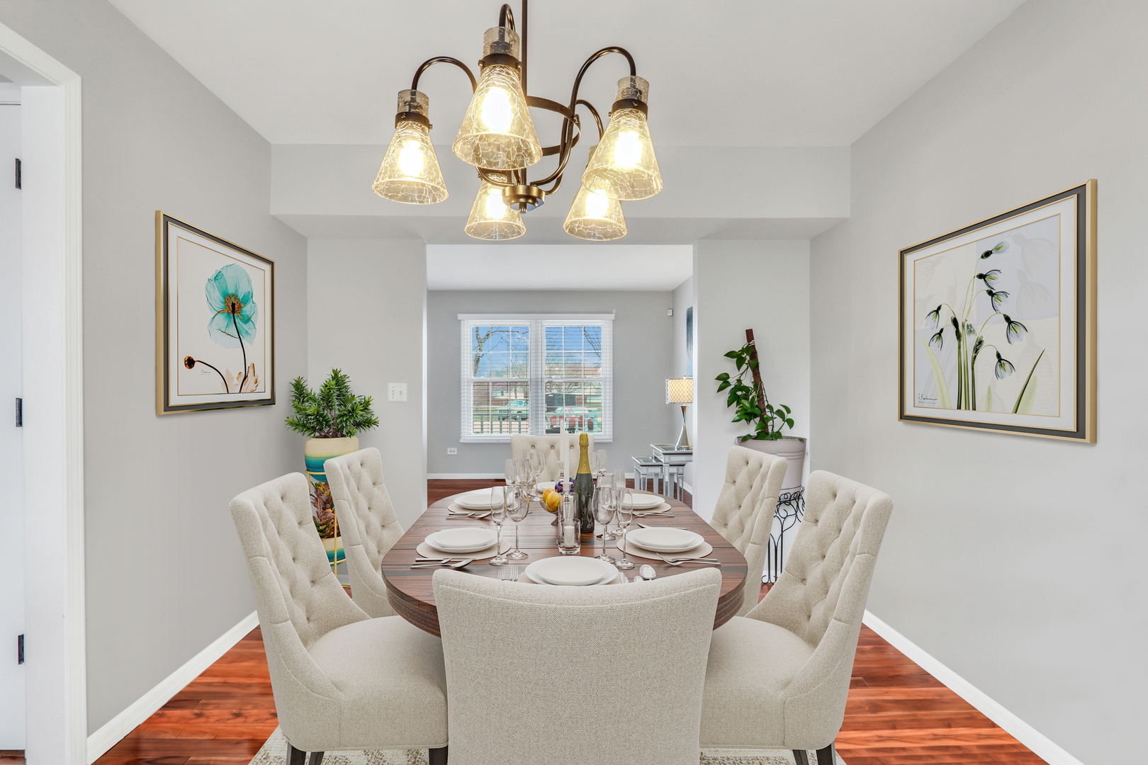 4049 Ridge Road Zion, IL 60099 - Photo 4 of 28 a view of a dining room with furniture wooden floor and a chandelier