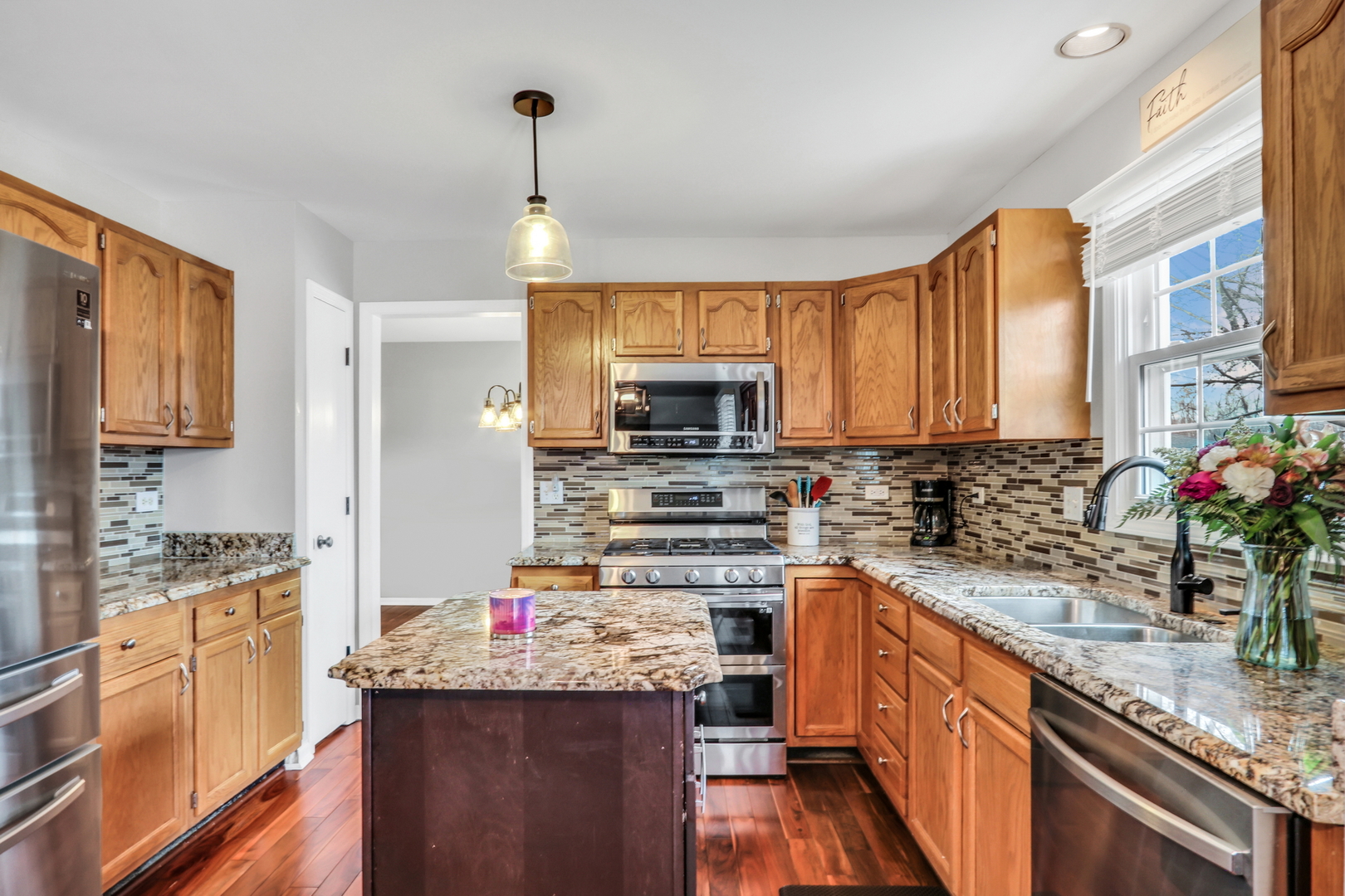 4049 Ridge Road Zion, IL 60099 - Photo 8 of 28 a kitchen that has a lot of cabinets and wooden floor