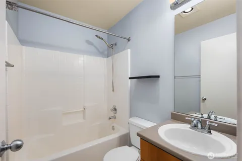 a bathroom with a sink toilet and a bathtub