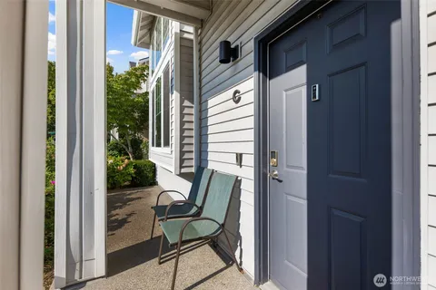 a view of balcony with chair and potted plant