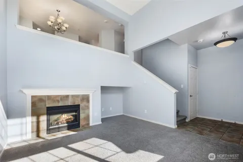 a view of an empty room and fire place