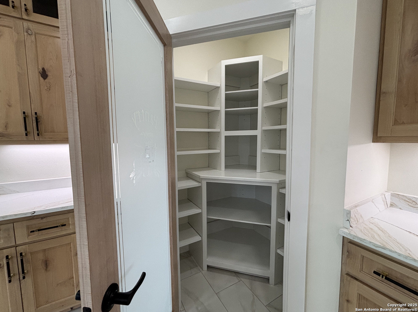 809 North Camp Street Uvalde, TX 78801 - Photo 16 of 30 a view of walk in closet with empty racks