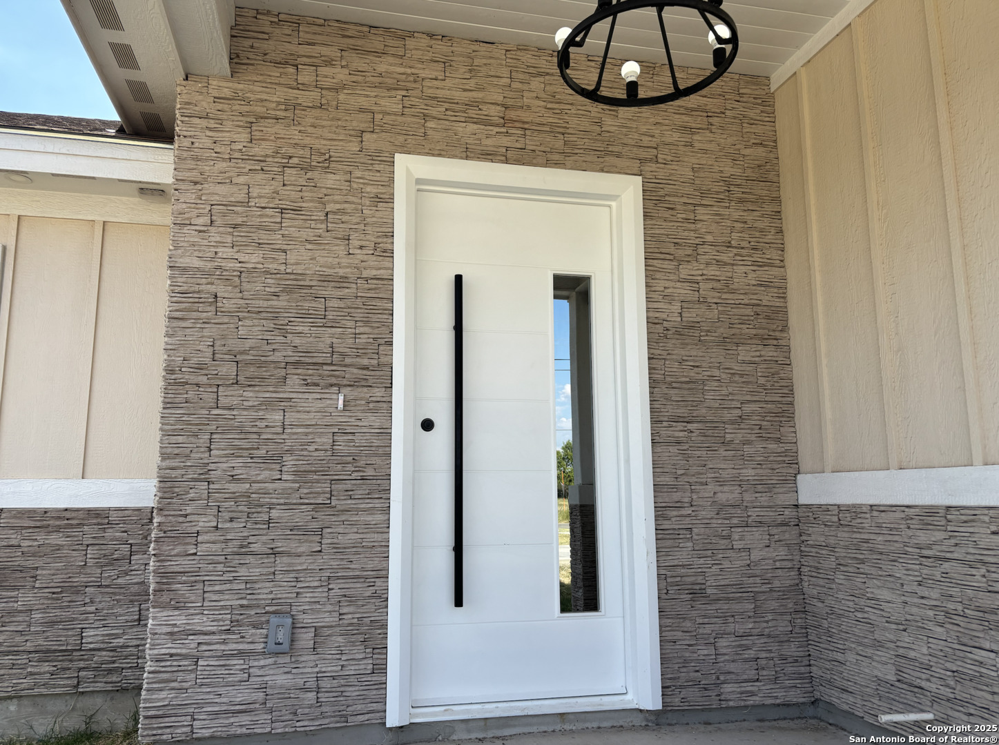 809 North Camp Street Uvalde, TX 78801 - Photo 3 of 30 a view of a door and chair in a room