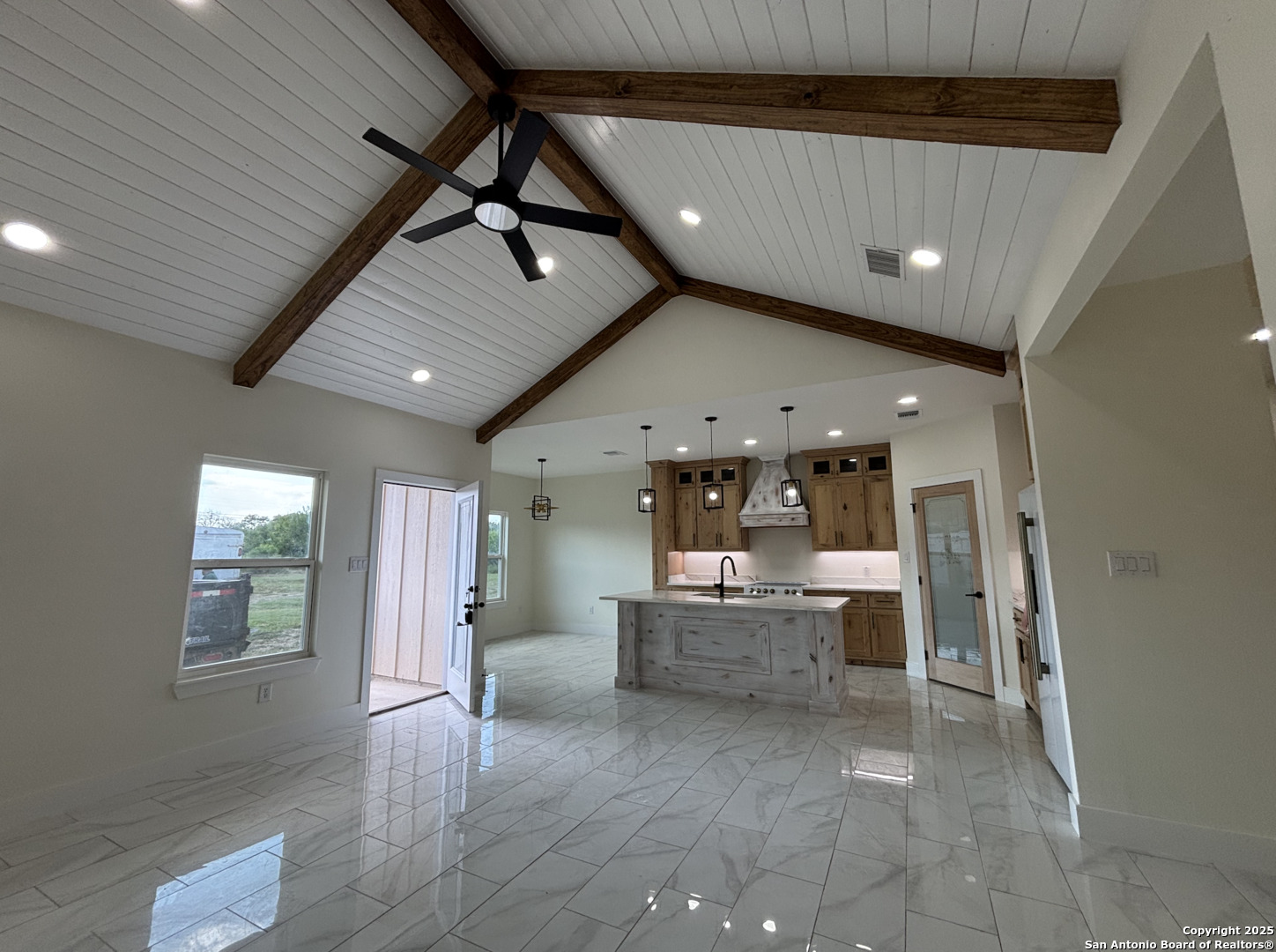 809 North Camp Street Uvalde, TX 78801 - Photo 8 of 30 a view of kitchen with refrigerator and window