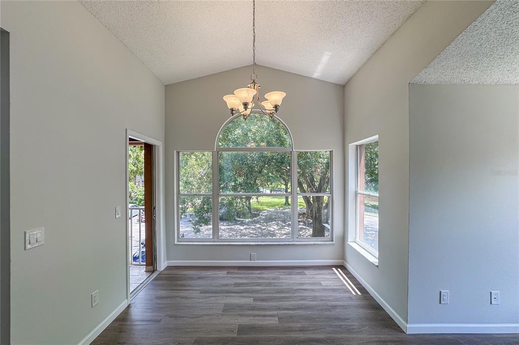 5436 East Michigan Street, Unit 4 Orlando, FL 32812 - Photo 12 of 37 a room with window and wooden floor