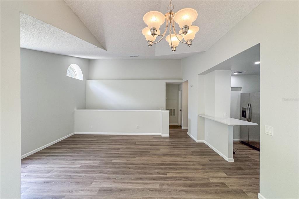 5436 East Michigan Street, Unit 4 Orlando, FL 32812 - Photo 17 of 37 a view of empty room with wooden floor