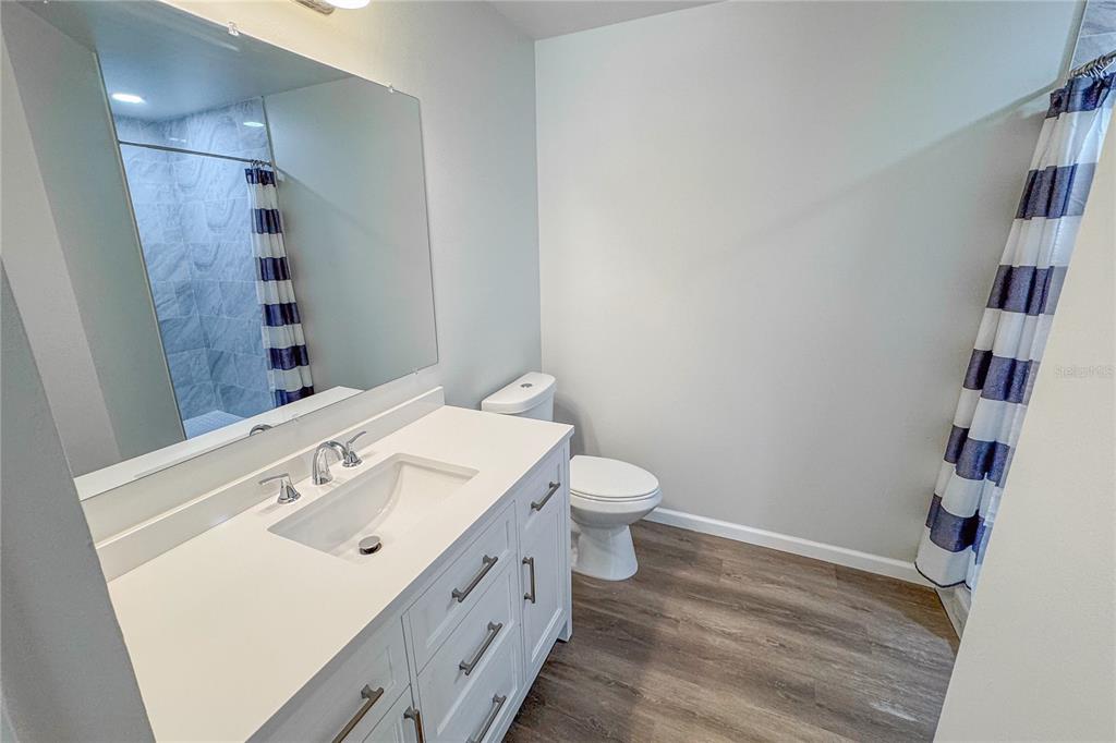 5436 East Michigan Street, Unit 4 Orlando, FL 32812 - Photo 24 of 37 a bathroom with a sink and a toilet