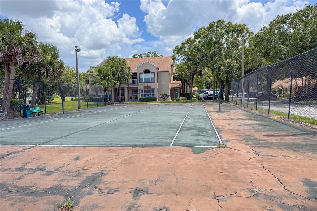 5436 East Michigan Street, Unit 4 Orlando, FL 32812 - Photo 26 of 37 a view of a playground with basketball court