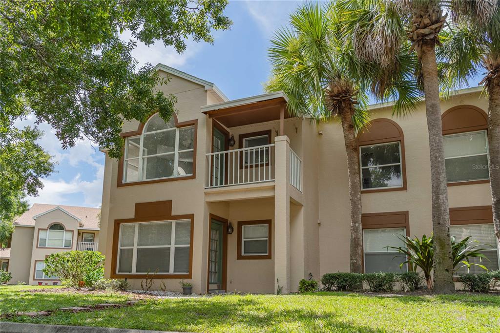 5436 East Michigan Street, Unit 4 Orlando, FL 32812 - Photo 32 of 37 a front view of a house with yard and green space