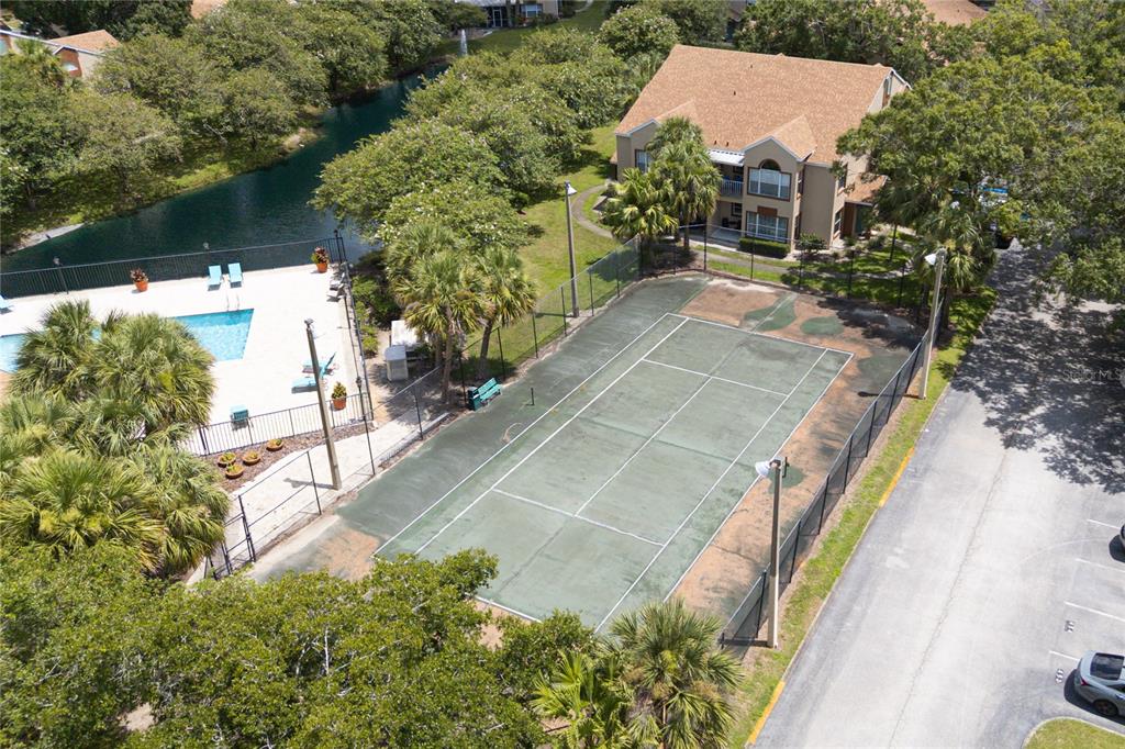 5436 East Michigan Street, Unit 4 Orlando, FL 32812 - Photo 34 of 37 an aerial view of a house with a yard and greenery