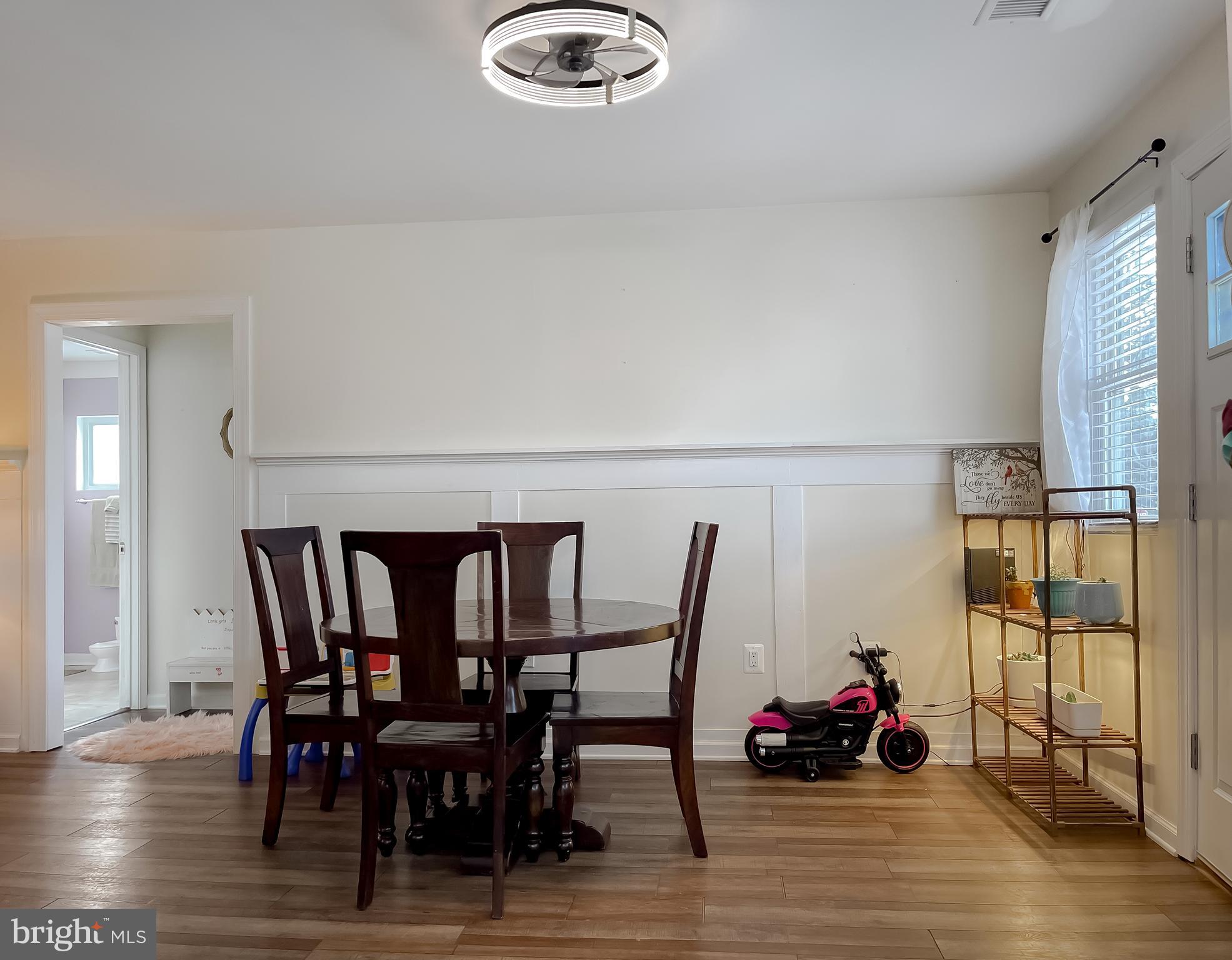 17262 Larimer Street Piney Point, MD 20674 - Photo 11 of 44 a view of a dining room with furniture and wooden floor