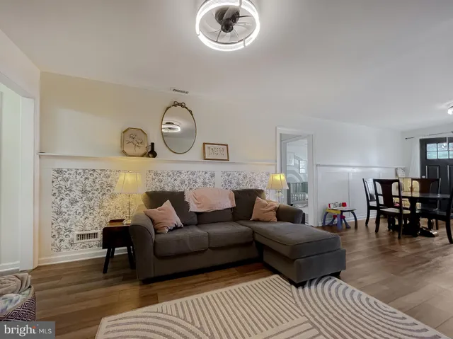 a spacious bedroom with a bed and a couch