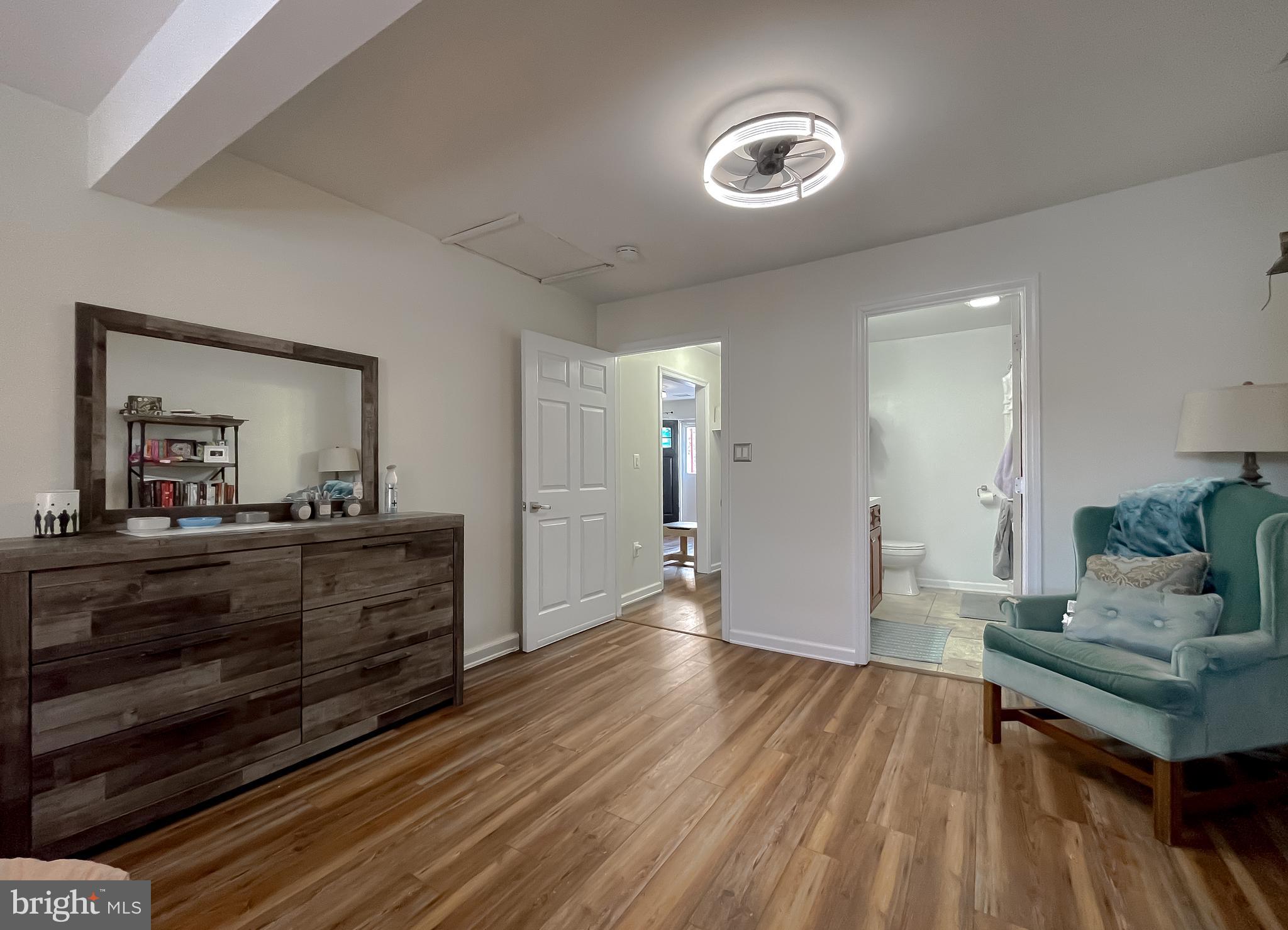17262 Larimer Street Piney Point, MD 20674 - Photo 16 of 44 a room with wooden floor and furniture