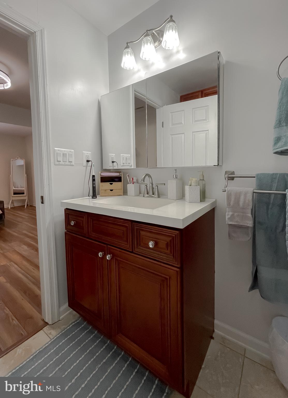 17262 Larimer Street Piney Point, MD 20674 - Photo 20 of 44 a bathroom with a sink and a mirror
