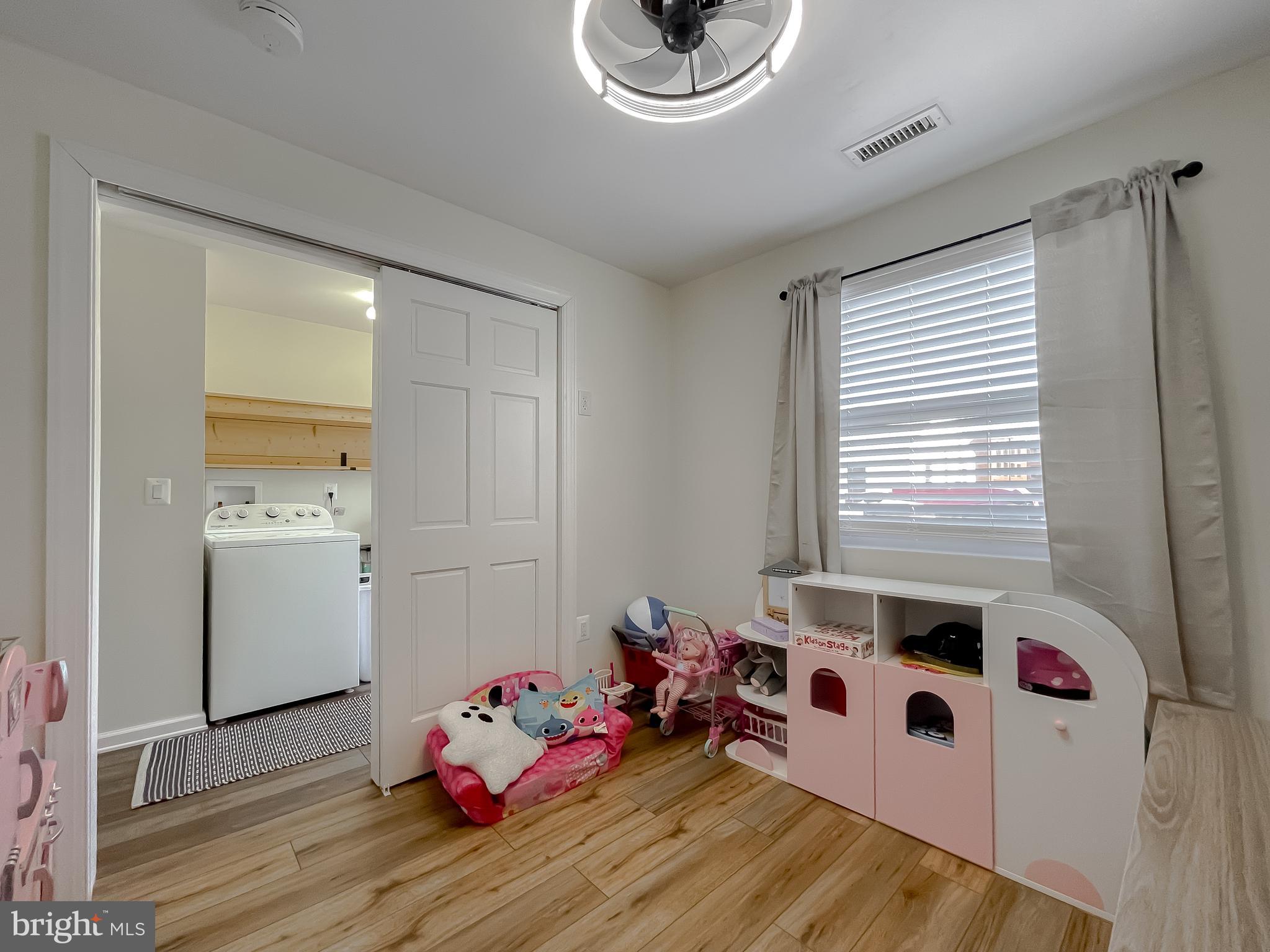 17262 Larimer Street Piney Point, MD 20674 - Photo 26 of 44 a bedroom with furniture and a window
