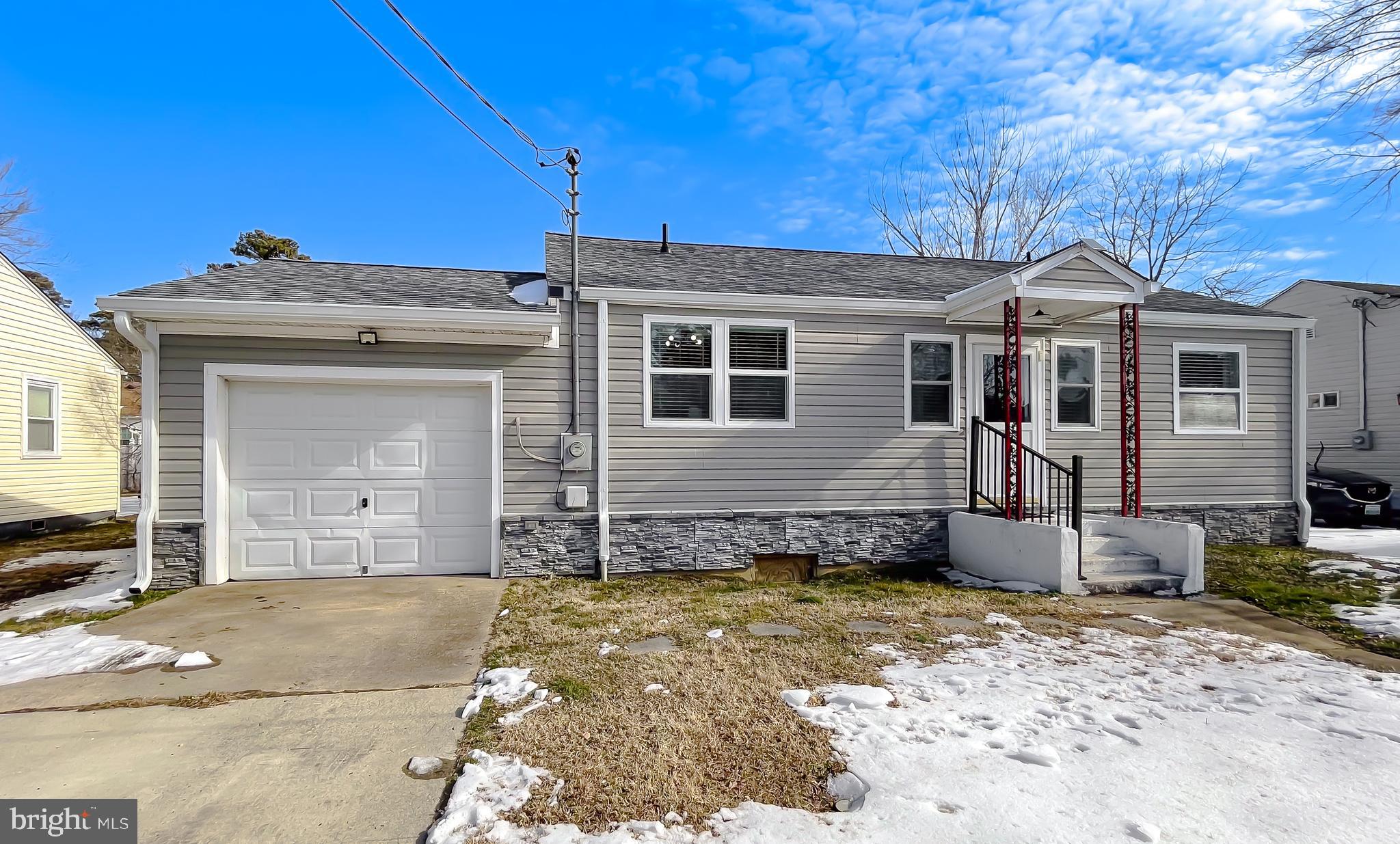17262 Larimer Street Piney Point, MD 20674 - Photo 37 of 44 a front view of a house with a garage