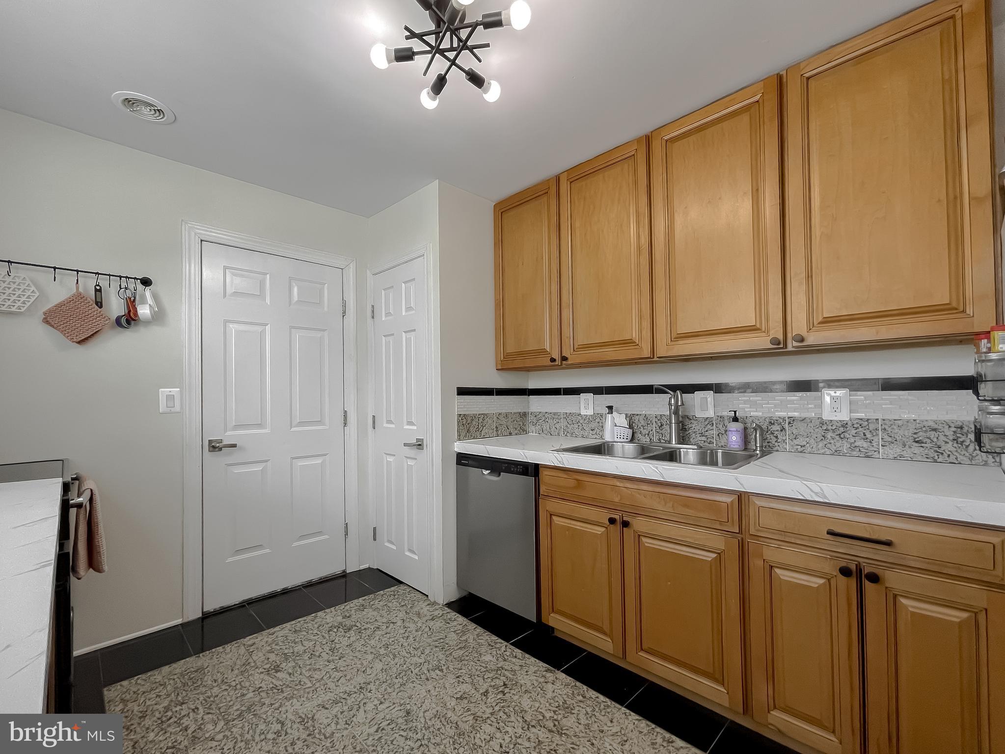17262 Larimer Street Piney Point, MD 20674 - Photo 8 of 44 a kitchen with a sink and cabinets