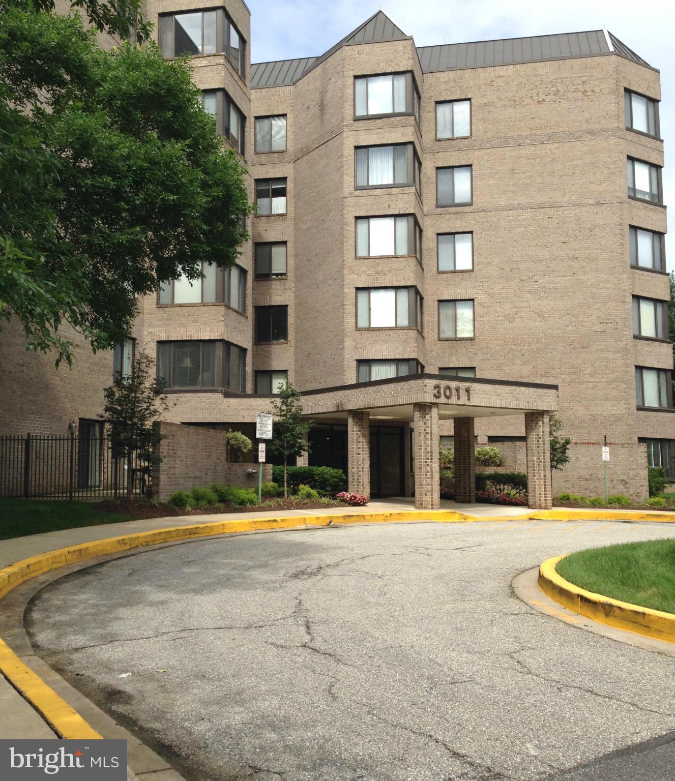 3011 Fallstaff Road, Unit 107A Baltimore, MD 21209 - Photo 1 of 14 a view of a building with many windows