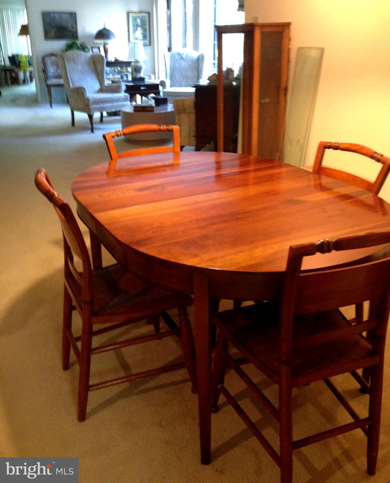 3011 Fallstaff Road, Unit 107A Baltimore, MD 21209 - Photo 5 of 14 a dining room with furniture and wooden floor