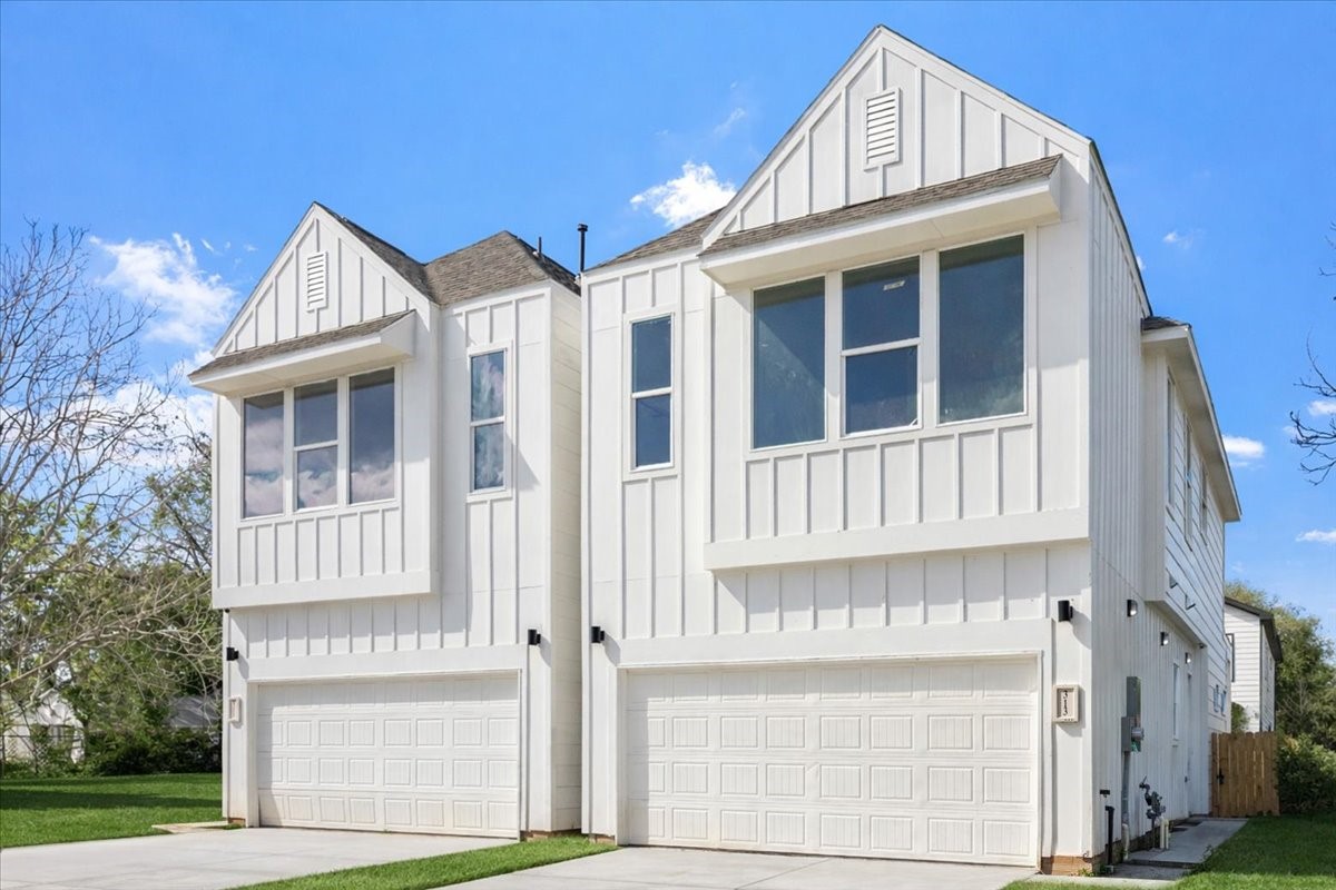 311 Tennessee Street Houston, TX 77029 - Photo 2 of 38 a view of a brick house with a large windows and a yard